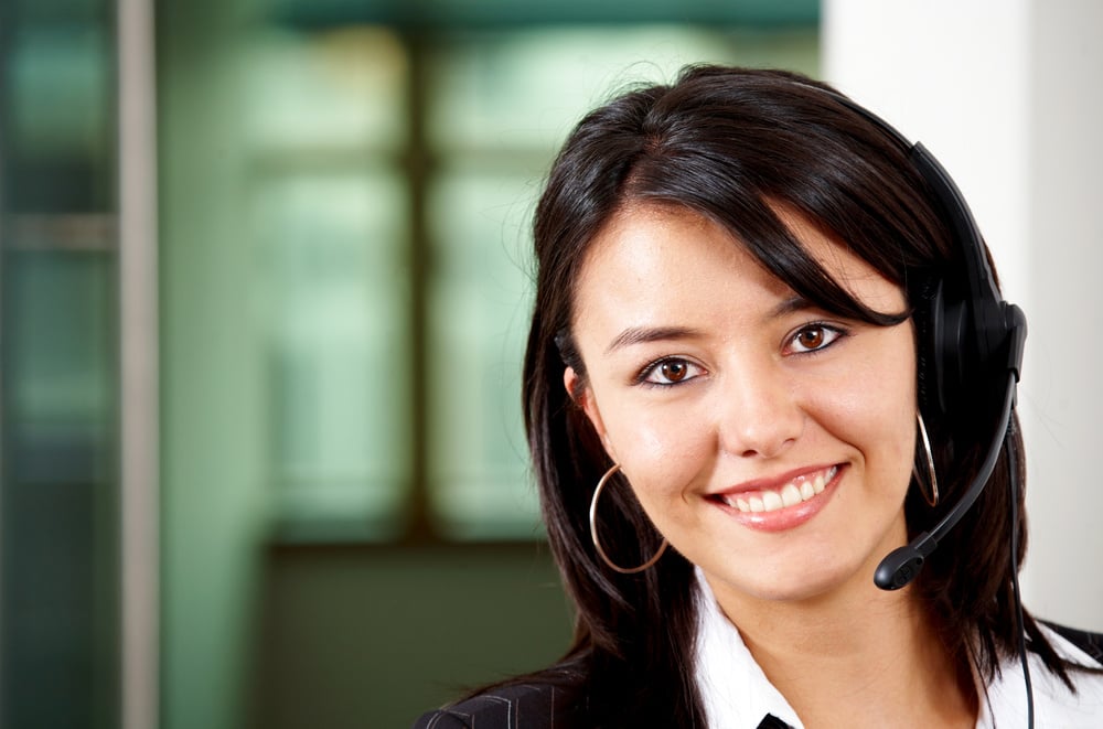 beautiful business customer service woman - smiling in an office